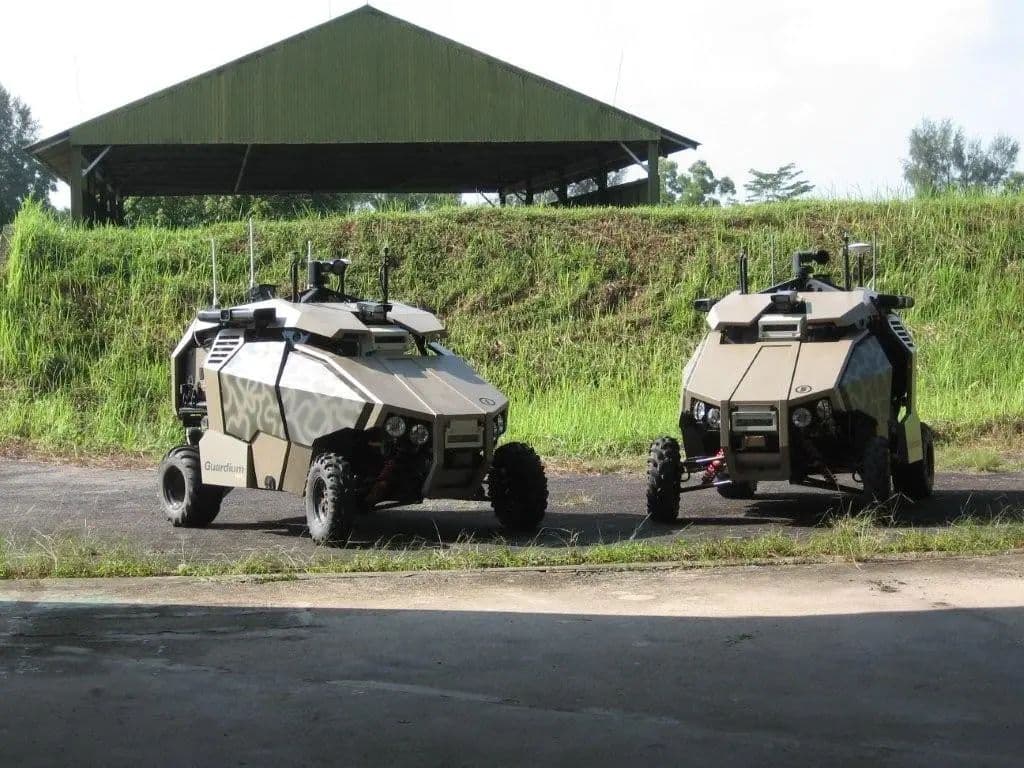 Two uncrewed ground vehicles on a test track